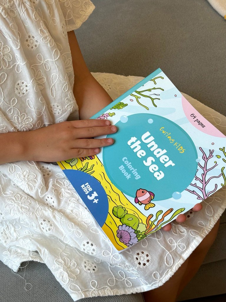 a kid holding the book