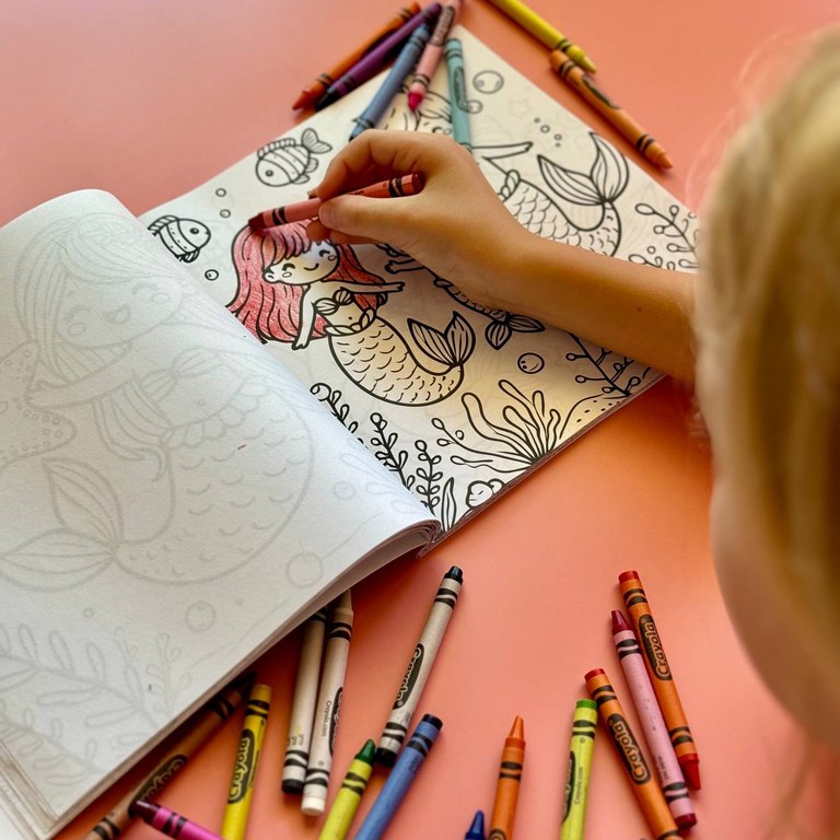 A kid coloring the book